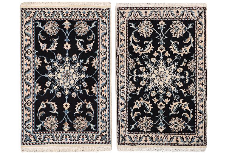 A pair of rugs, Nain, part silk, ca. 89 x 57 cm & ca. 90 x 60 cm.