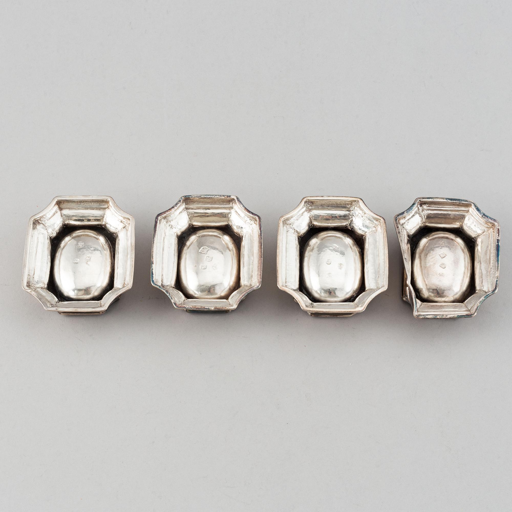 Four English early 18th century parcel-gilt silver salt-cellars, mark of Edward Wood, London 1727.