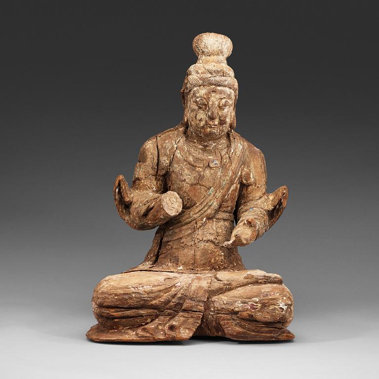 A wooden sculpture of a seated Bodhisattva, presumably Ming dynasty (1368-1644).