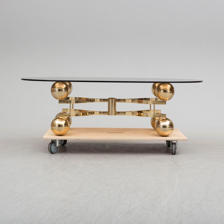 A French 1970s brass and glass coffie table.