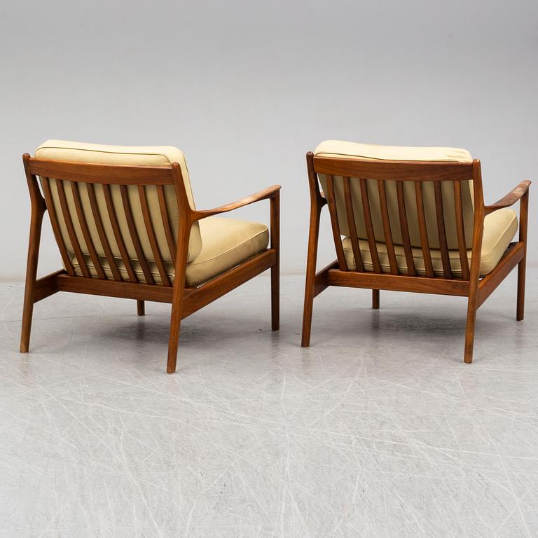 A pair of USA-75 easy chairs by Folke Ohlsson, DUX.