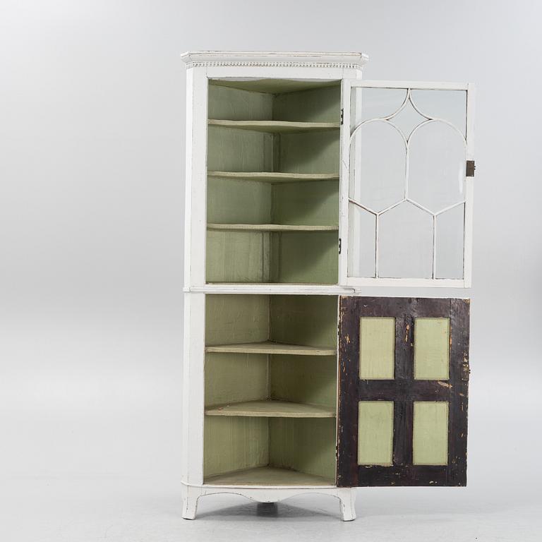 A gustavian style painted corner cabinet, 19th century.