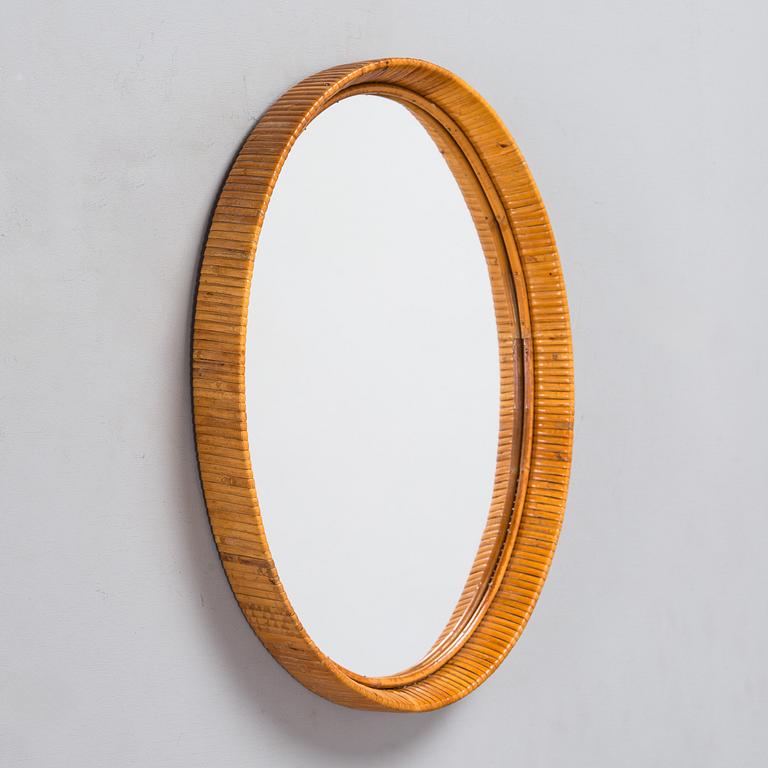 A mid-20th-century rattan wall mirror.