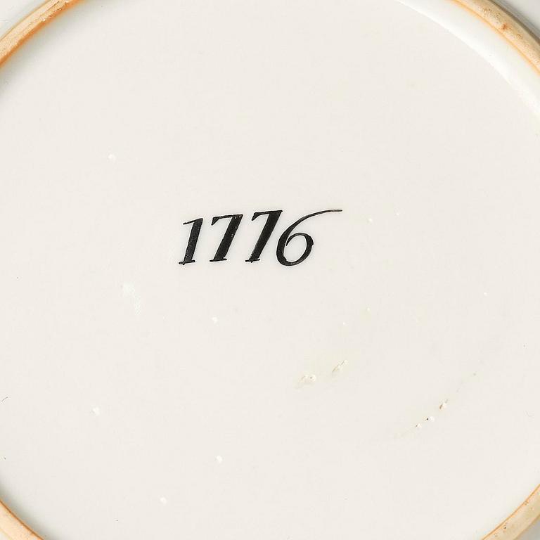 A famille rose armorial cup and stand with the monogram of the Swedish King Gustavus III, Qing dynasty, 18th century.