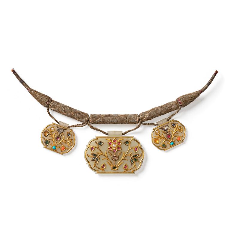 Three gold-inlaid and gem-set jade pendants, India, 19th century.