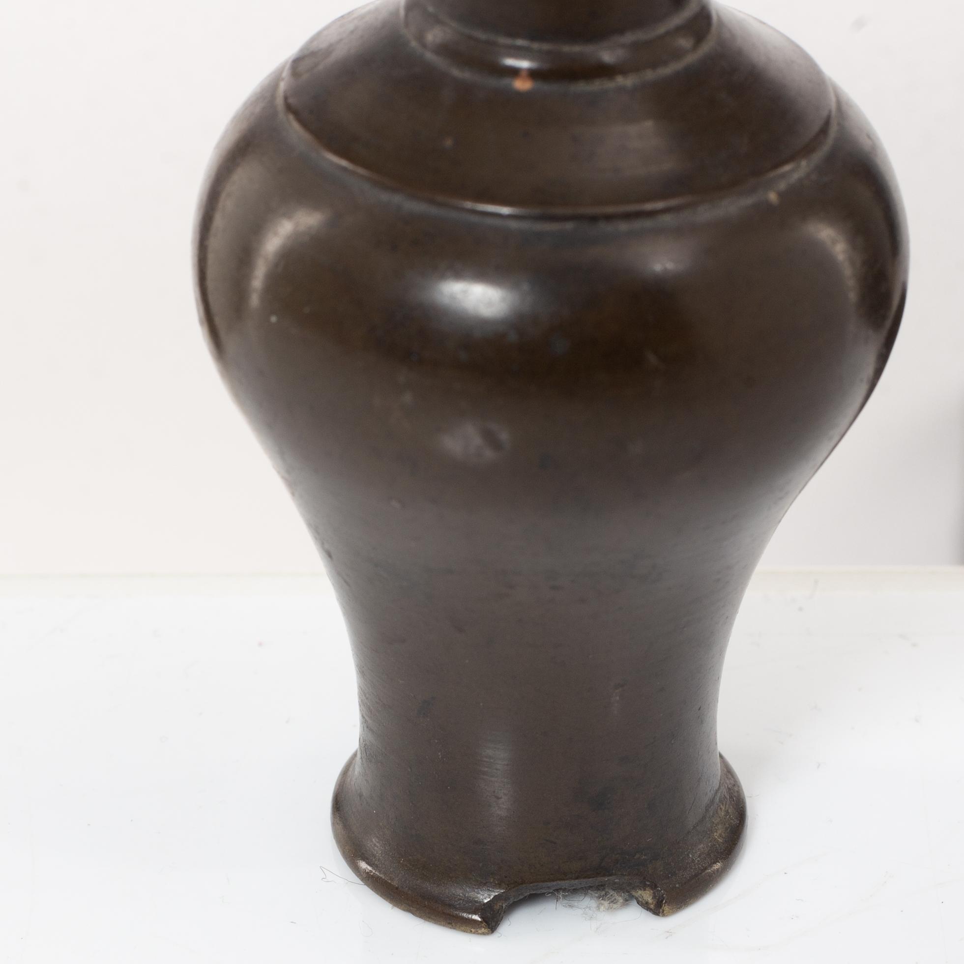 A Chinese bronze vase, joss stick holder and a bamboo brush pot, Qing dynasty.