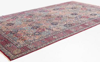 A semi-antique Kerman carpet, of Safavid 'vase' design, ca 484 x 291 cm.