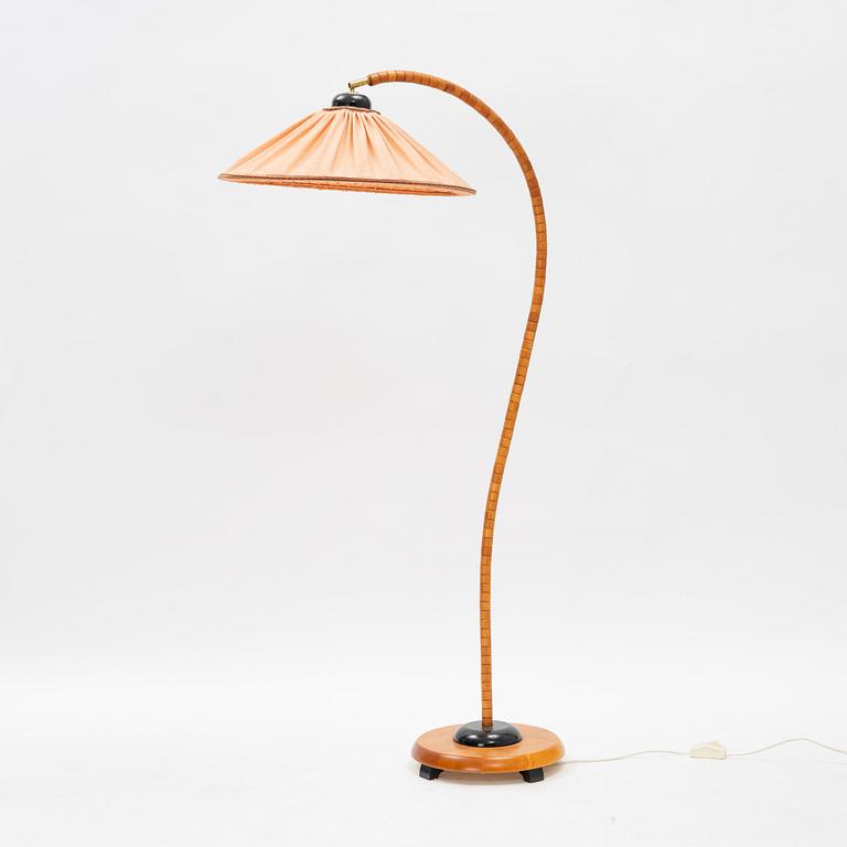 A stained beech floor light, Markslöjd, late 20th Century.