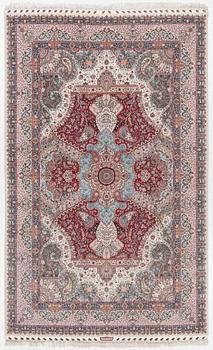 A Tabriz carpet, 210 x 195 cm. signed.