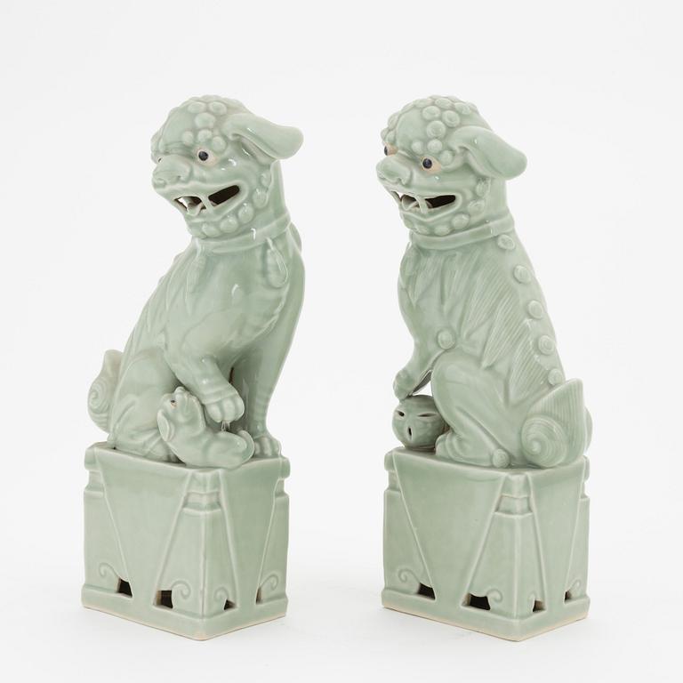 A pair of celadon glazed figures of buddhist lions, China, 20th Century.