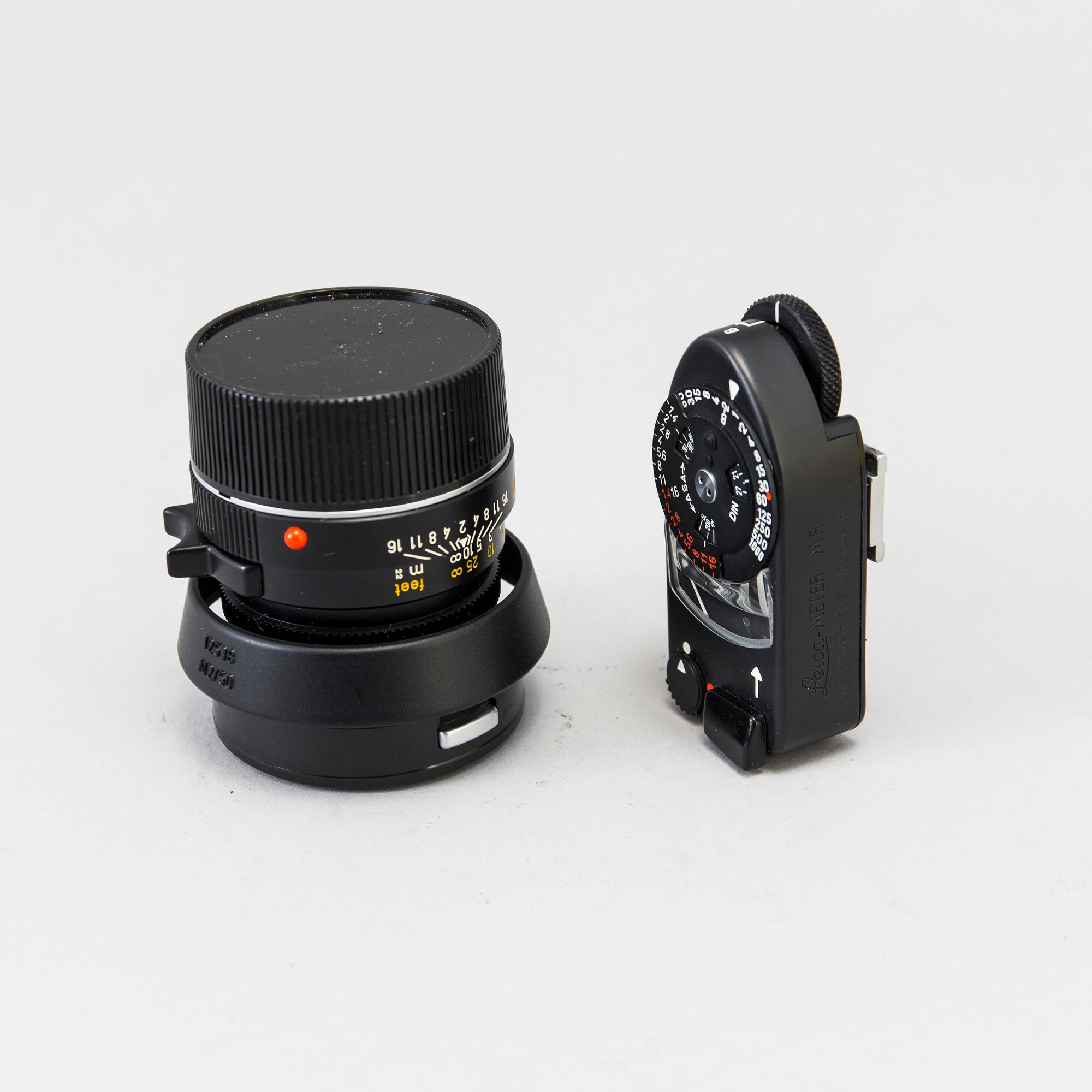 a black body Leica M4-P camera with no 1605951 made by Leitz Canada in 1982. With two lenses and a Leica Meter.