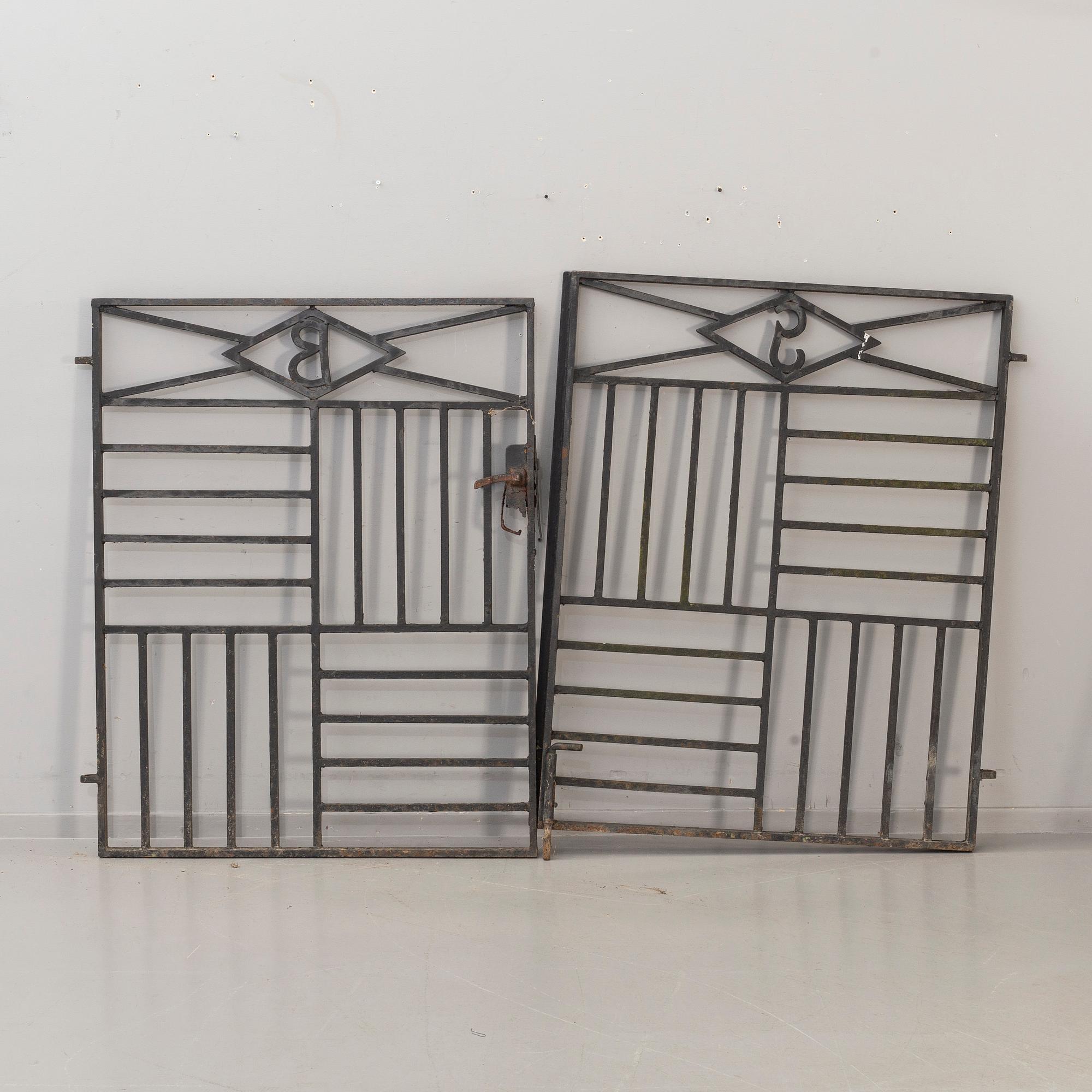 A pair of cast iron gates from the first half of the 20th Century.
