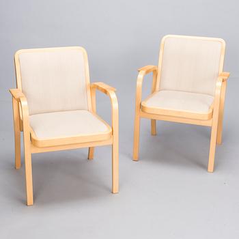 ALVAR AALTO, Pair of model 'E45' armchairs for Artek, late 20th Century.