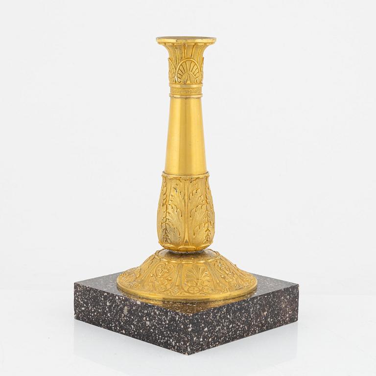 A bronze and porphyry candlestick, 20th Century.