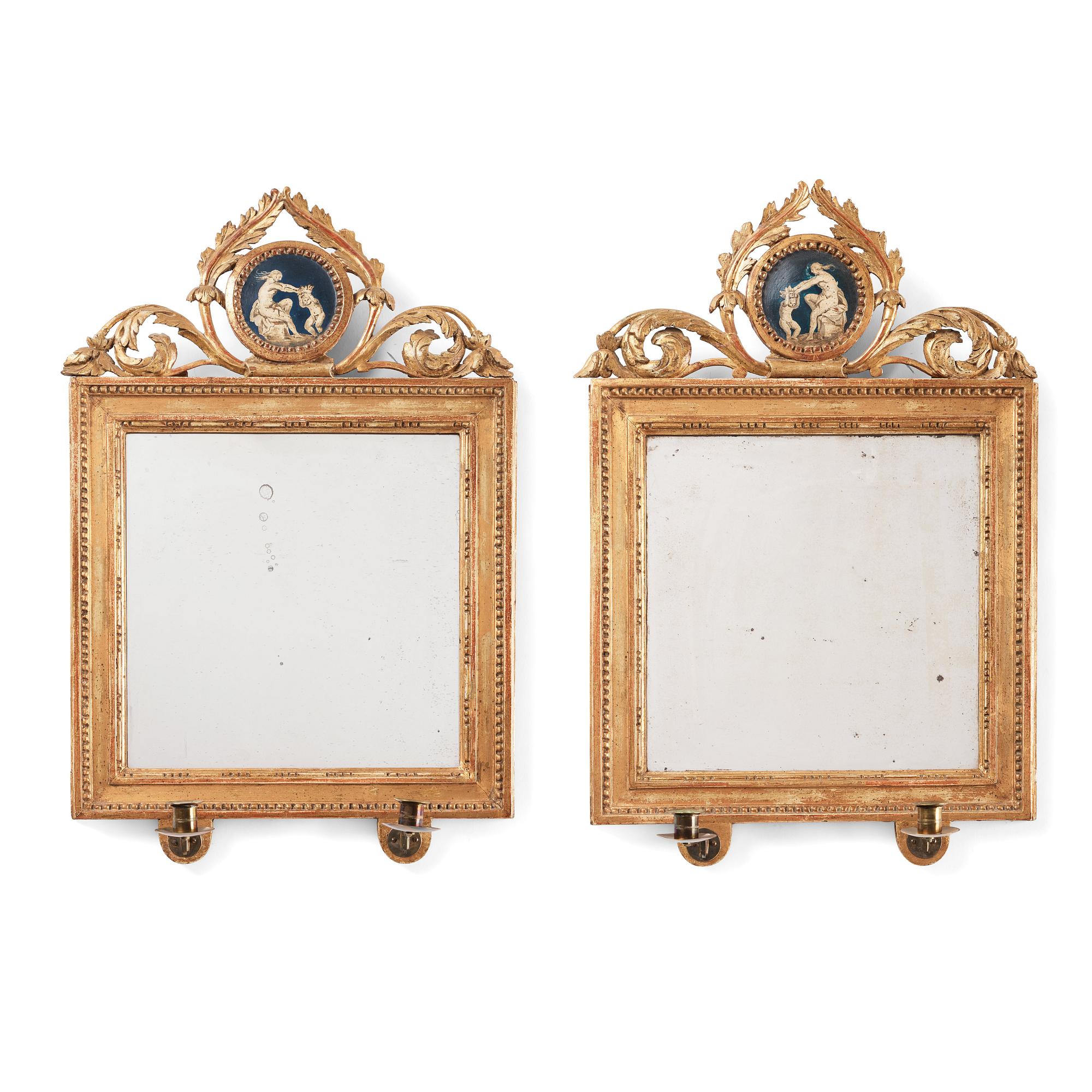 A pair of Gustavian two-light girandole mirrors by Lago Lundén active in Stockholm 1773, dead 1819).