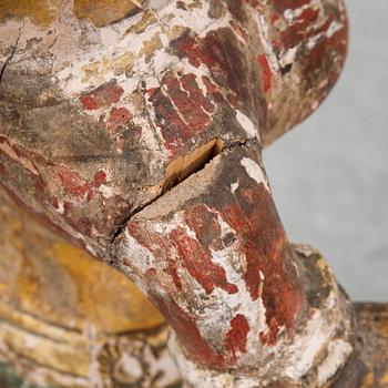 A carved and painted Indian religious effigy, ca. 1900.