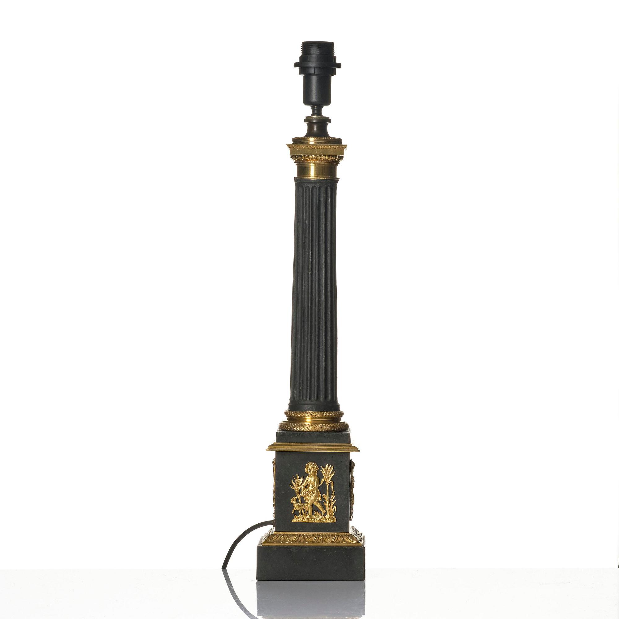 A French Empire ormolu and tole lamp, early 19th century.