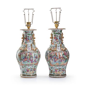 A pair of famille rose Canton vases made in to lamps, Qing dynasty, 19th Century.