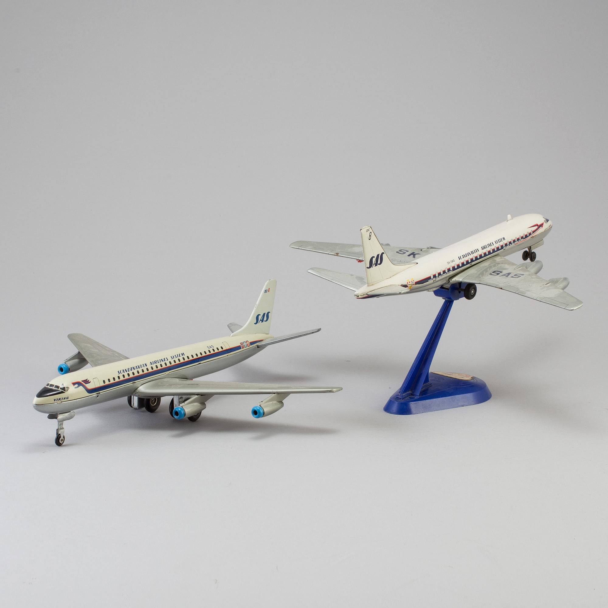 Two tinplate toy planes by Tomiyama and Arnold, Japan and Germany, 1960s.