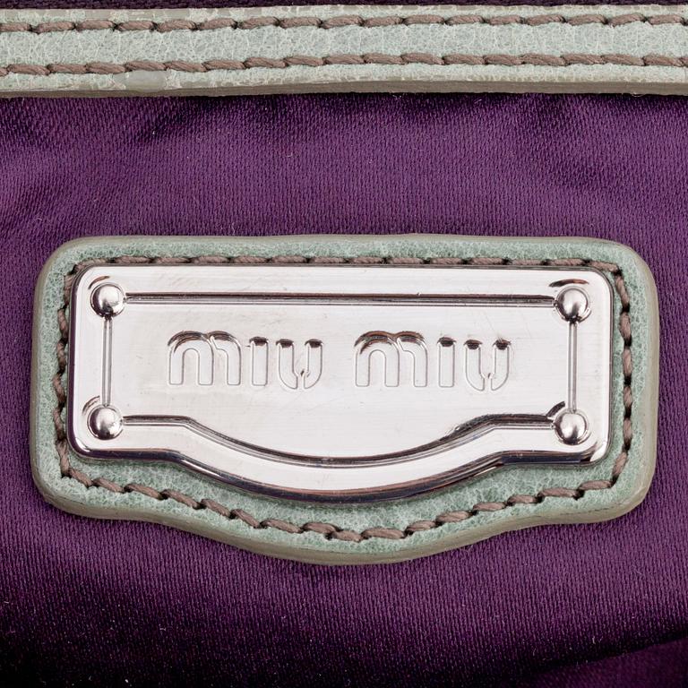 MIU MIU, a green leather shoulder bag.