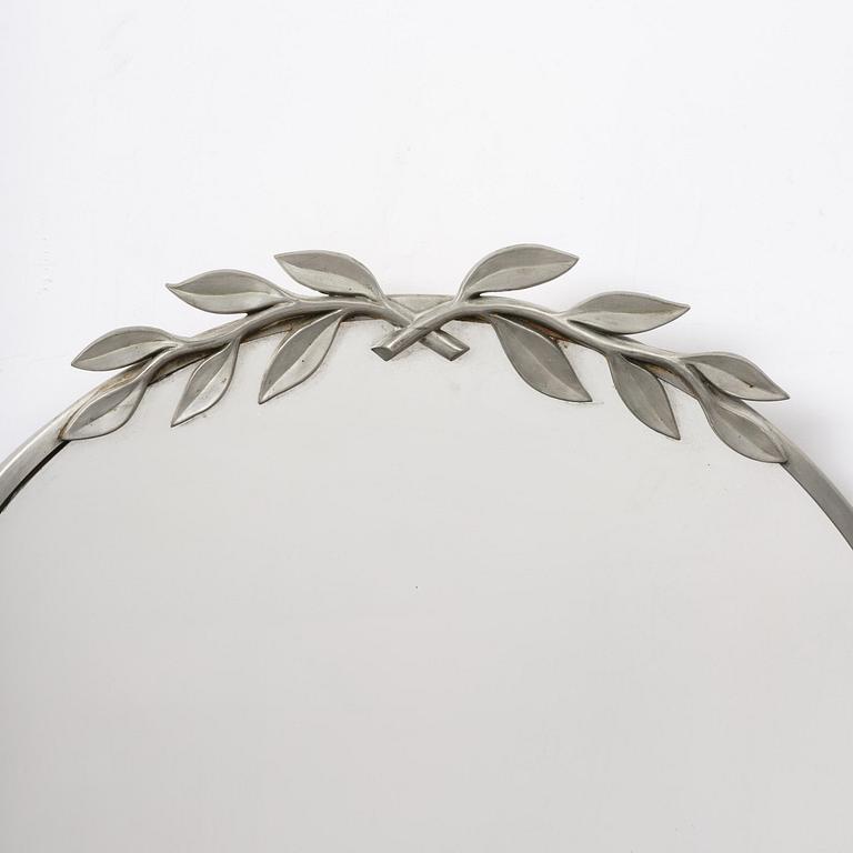 Estrid Ericson, a pewter framed mirror modell "A 884", Firma Svenskt Tenn, Stockholm, 1934.