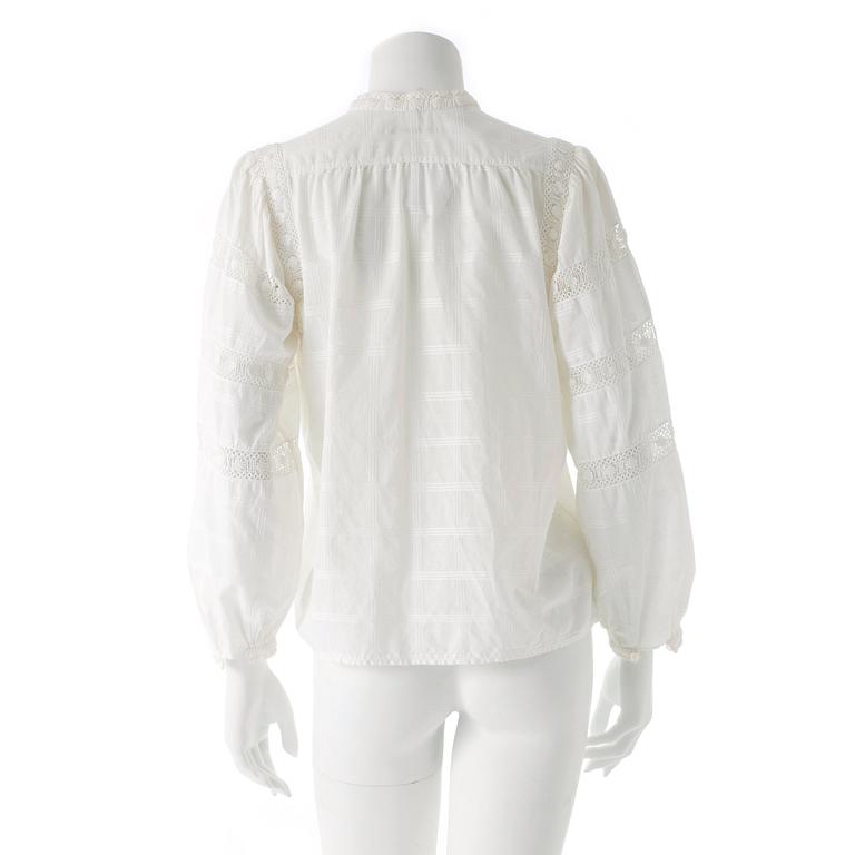 YVES SAINT LAURENT, a white cotton blouse.
