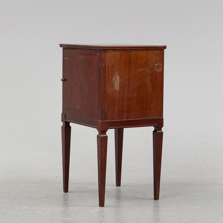 A mahogany bedside cabinet by Carl Johanssons Möbleringsaffär, around the year 1900.
