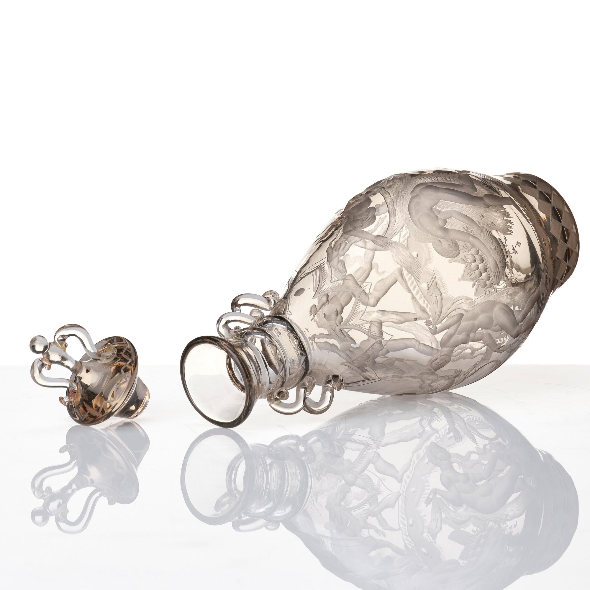 Simon Gate, an engraved glass decanter with stopper, Orrefors 1926, model 234.