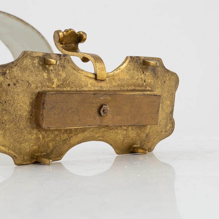 A gilt brass candlestick, 20th Century with older parts.