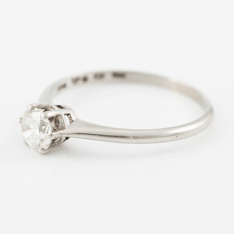 Platinum ring with brilliant-cut diamond.