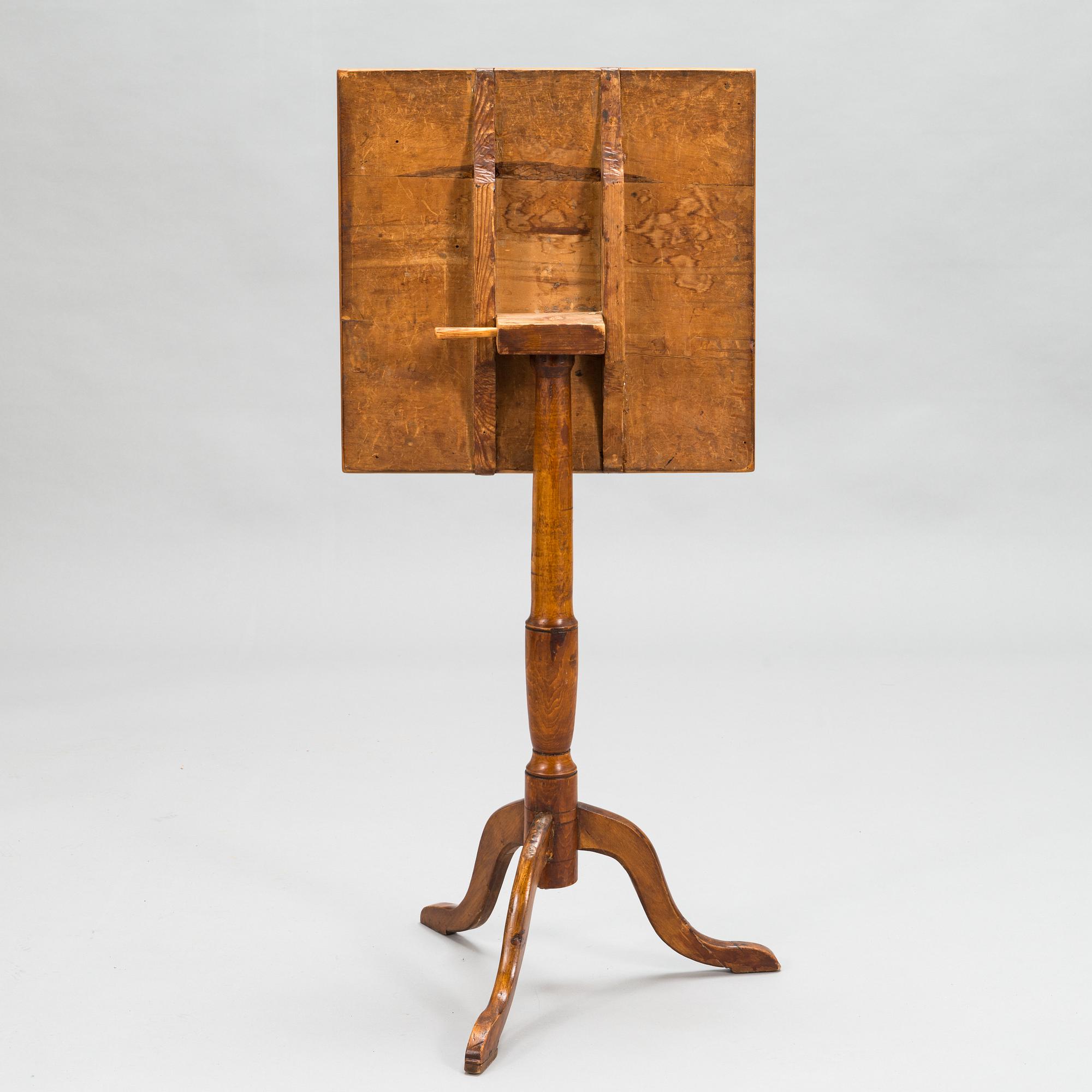 A tilt-top tripod table,  first half of the 19th century.