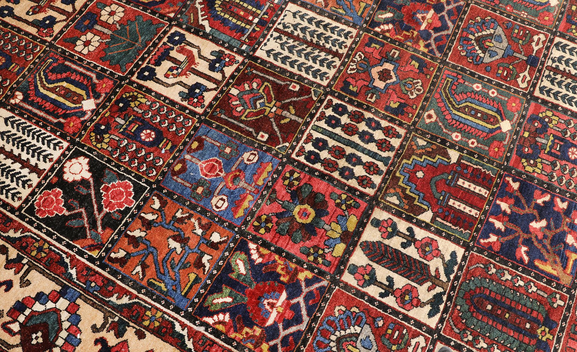 A semi-antique Baktiari carpet, approx. 360 x 308 cm.