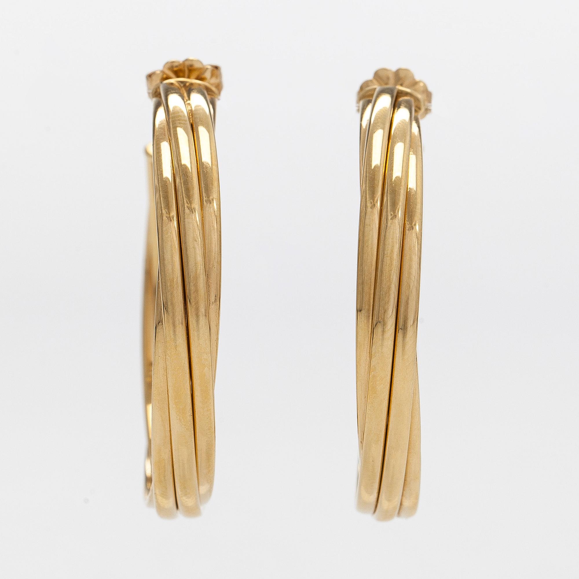 Tiffany & Co, Paloma Picasso, "Melody" hoop earrings in 18K gold.