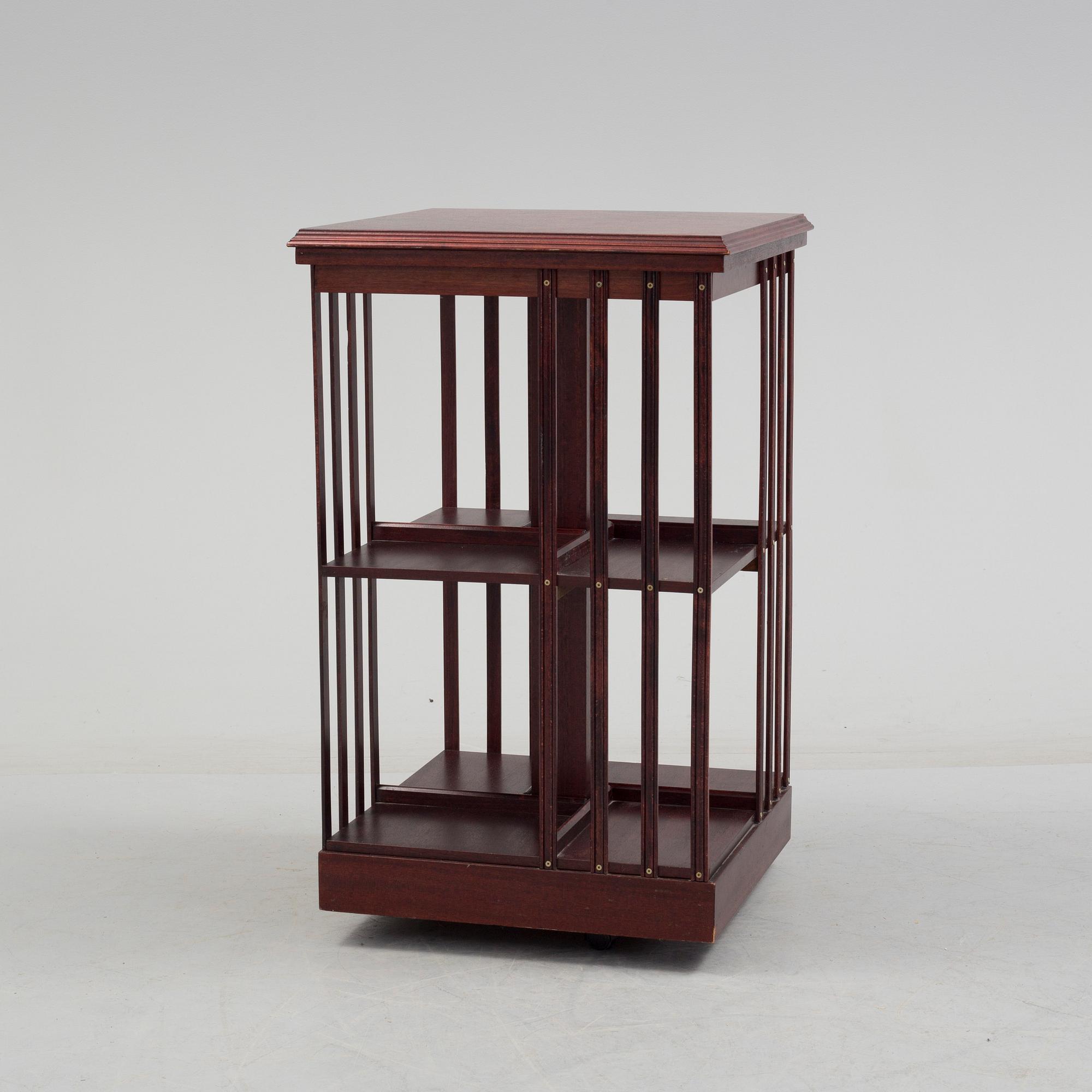 An second half of the 20th century turning book shelf veneered with mahogny.