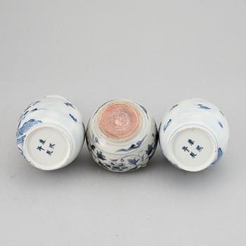 A pair of blue and white 'double gourd' vases, Qing dynasty, late 19th century, and a ceramic jar, south east asian.