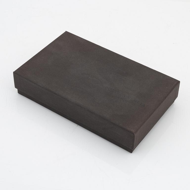 Bottega Veneta, a brown leather wallet.