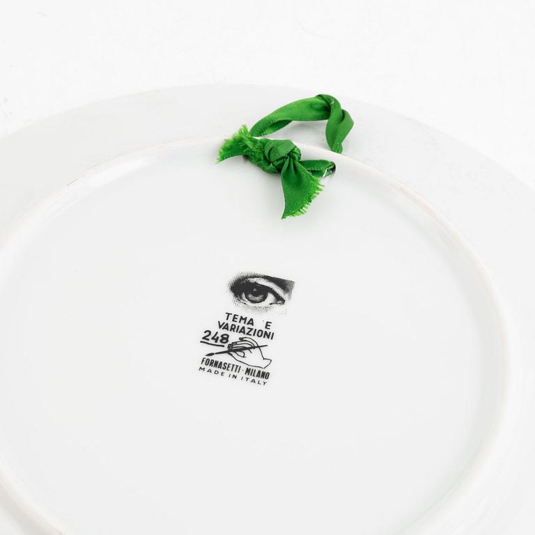 Piero Fornasetti, a porcelain dish and a plate, Milano, Italy.