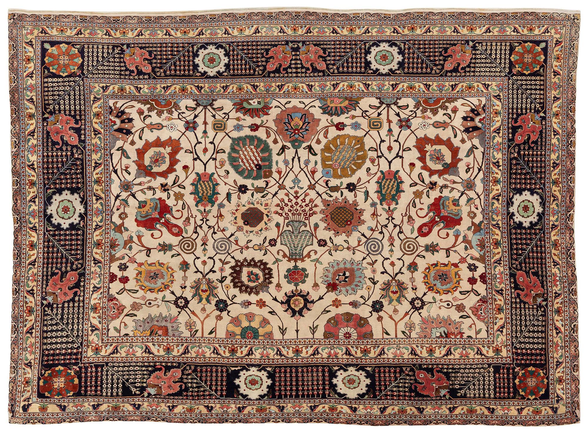 A semi-antique Tabriz carpet, Northwest Persia, of Safavid 'Vase' design, c.328 x 242 cm.