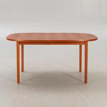 A 1960s/70s teak dining table.