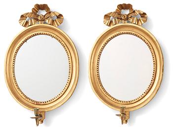 A pair of Gustavian one-light giltwood girandole mirrors, late 18th century.