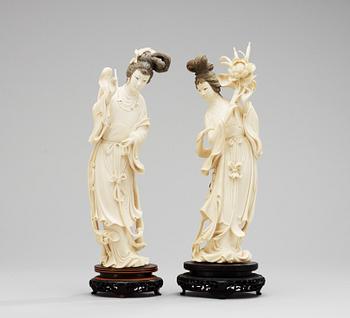 1. A pair of 20th Century Chines ivory figures.