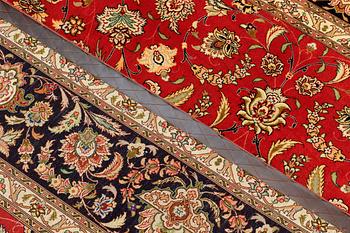 A carpet, Täbriz part silk, 341 x 248 cm.