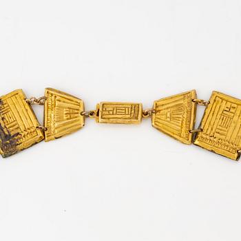 A modern Egyptian-style gold and pearl necklace.