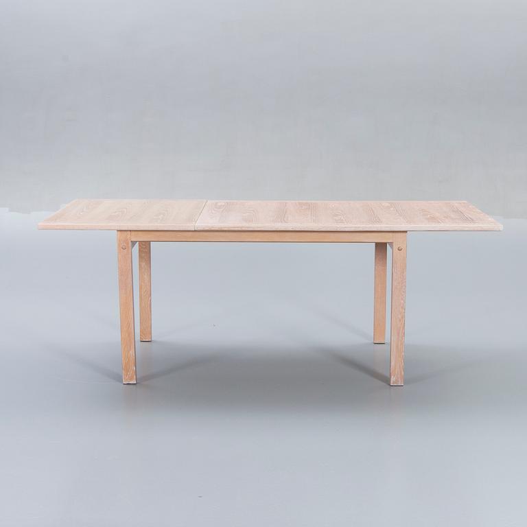 A Danish 1960s dining table and 6 chairs,