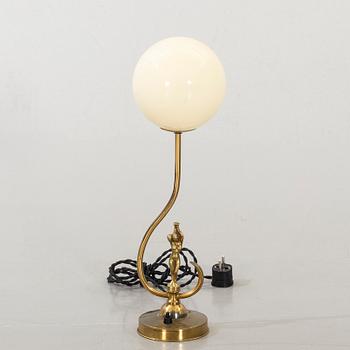 A BRASS TABLE LAMP.