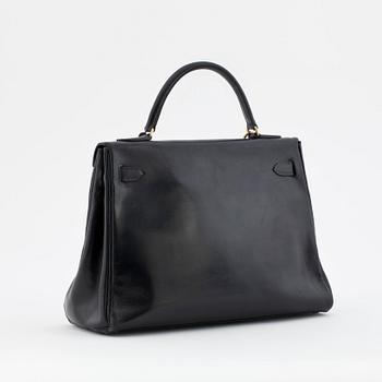 HERMÈS, a box black "Kelly 32" bag, before 1960.