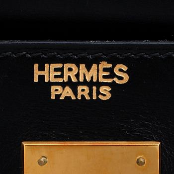 HERMÈS, a black leather bag, "Kelly 32".