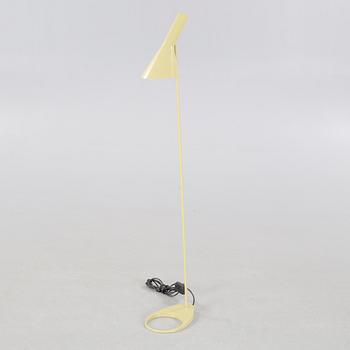 An "AJ" floor lamp, designed by Arne Jacobsen for Louis Poulsen, 21st century.