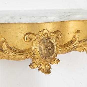 A rococo style mirror and console table, around 1900.