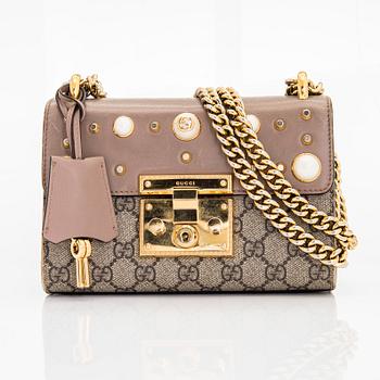 Gucci, a shoulder bag.